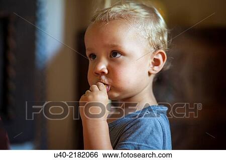 Stock Photograph - Boy eating.. Fotosearch