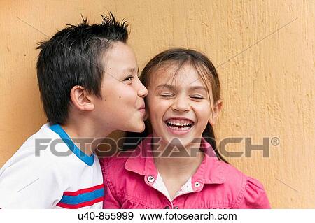 Boy giving girl first kiss View Large Photo Image Stock Photo - Boy giving girl first kiss. Fotosearch