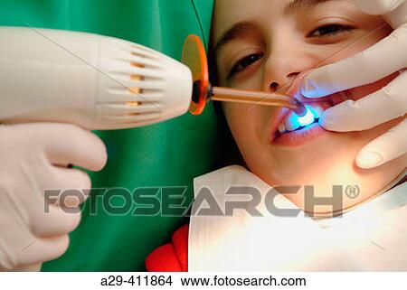 Boy having dental care View Large Photo Image Picture - Boy having dental care. Fotosearch