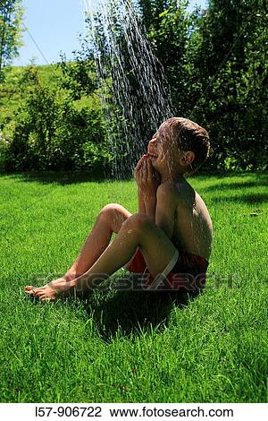 boy having shower outdoors, Switzerland View Large Photo Image Stock Image - boy having shower outdoors, Switzerland. Fotosearch