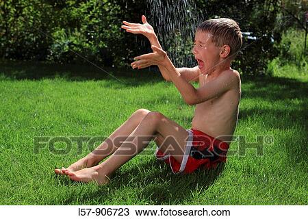 boy having shower outdoors, Switzerland View Large Photo Image Stock Image - boy having shower outdoors, Switzerland. Fotosearch