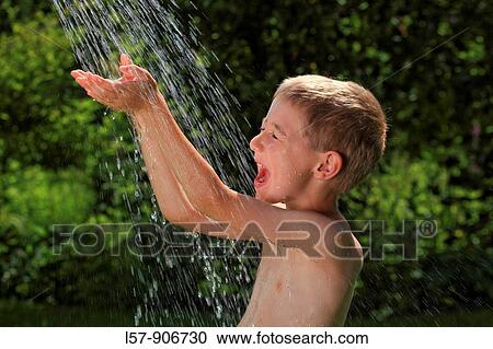 boy having shower outdoors, Switzerland View Large Photo Image Stock Image - boy having shower outdoors, Switzerland. Fotosearch