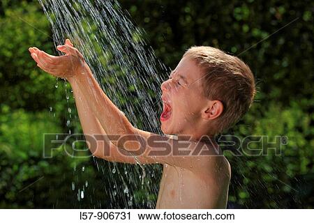 boy having shower outdoors, Switzerland View Large Photo Image Stock Image - boy having shower outdoors, Switzerland. Fotosearch