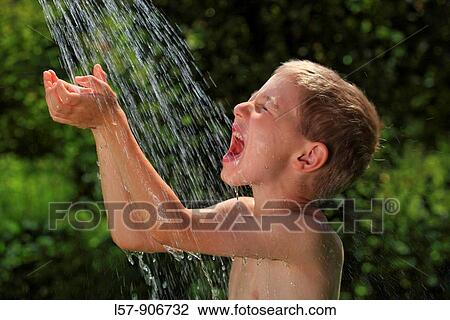 boy having shower outdoors, Switzerland View Large Photo Image Stock Image - boy having shower outdoors, Switzerland. Fotosearch