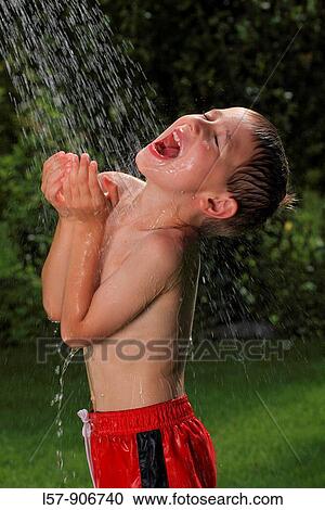 boy having shower outdoors, Switzerland View Large Photo Image Stock Image - boy having shower outdoors, Switzerland. Fotosearch