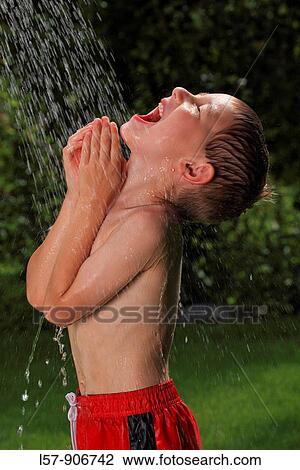 boy having shower outdoors, Switzerland View Large Photo Image Stock Image - boy having shower outdoors, Switzerland. Fotosearch