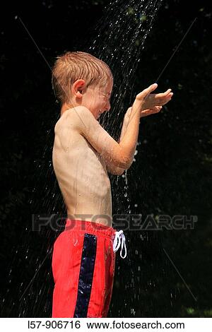 boy having shower outdoors, Switzerland View Large Photo Image Stock Photograph - boy having shower outdoors, Switzerland. Fotosearch