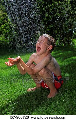 boy having shower outdoors, Switzerland View Large Photo Image Stock Photograph - boy having shower outdoors, Switzerland. Fotosearch