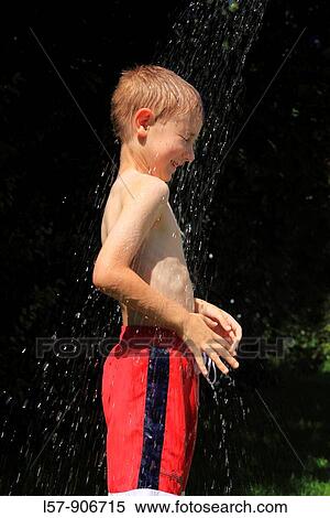 boy having shower outdoors, Switzerland View Large Photo Image Stock Photography - boy having shower outdoors, Switzerland. Fotosearch