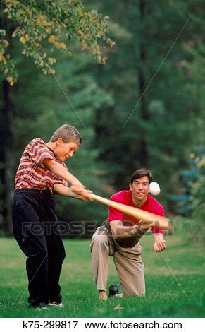 boy hitting a baseball View Large Photo Image Stock Photo - boy hitting a baseball. Fotosearch
