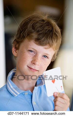 Boy holding an ace of hearts View Large Photo Image Stock Image - Boy holding an ace of hearts. Fotosearch
