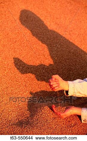 Boy holding handful of wheat View Large Photo Image Picture - Boy holding handful of wheat. Fotosearch