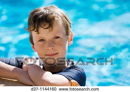 Boy in a swimming pool View Large Photo Image Stock Image - Boy in a swimming pool. Fotosearch