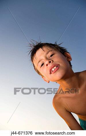Boy in bathing suit looking at camera at the beach, Hollywood, Florida, USA View Large Photo Image Stock Photograph - Boy in bathing suit looking at camera at the beach, Hollywood, Florida, USA. Fotosearch