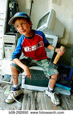 Boy in computer graveyard View Large Photo Image Stock Image - Boy in computer graveyard. Fotosearch
