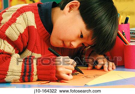 Boy in elementary school, Asian-American, Boston, MA View Large Photo Image Stock Image - Boy in elementary school, Asian-American, Boston, MA. Fotosearch