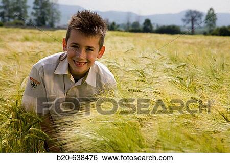 Boy in grain field. Arkaute, Alava, Euskadi, Spain View Large Photo Image Stock Photograph - Boy in grain field. Arkaute, Alava, Euskadi, Spain. Fotosearch