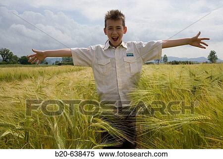 Boy in grain field. Arkaute, Alava, Euskadi, Spain View Large Photo Image Stock Photography - Boy in grain field. Arkaute, Alava, Euskadi, Spain. Fotosearch
