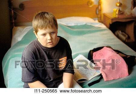 Boy in hotel room View Large Photo Image Stock Photography - Boy in hotel room. Fotosearch