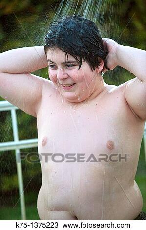Stock Image - boy in shower outdoors. Fotosearch