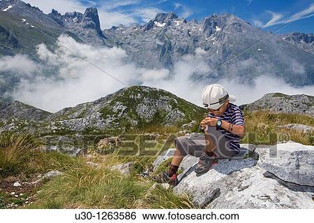 Boy in the summit of Pea Ma? n, Urrieles massif, in the Picos de Europa National Park, Asturias, Spain View Large Photo Image Stock Photograph - Boy in the summit of Pea Ma? n, Urrieles massif, in the Picos de Europa National Park, Asturias, Spain. Fotosearch