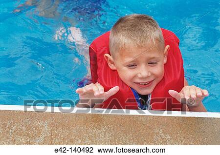 Boy in the swimming pool View Large Photo Image Stock Image - Boy in the swimming pool. Fotosearch