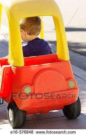 boy in toy car View Large Photo Image Stock Photo - boy in toy car. Fotosearch
