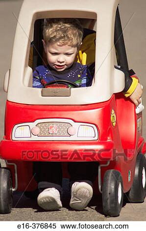 boy in toy car View Large Photo Image Stock Photography - boy in toy car. Fotosearch