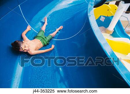 Boy in water slide in a cruise View Large Photo Image Stock Photography - Boy in water slide in a cruise. Fotosearch