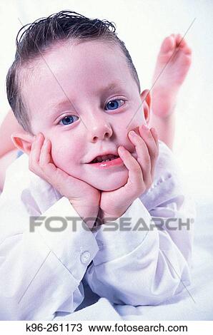 Stock Image - Boy in White. Fotosearch