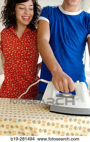 Boy ironing doing housework View Large Photo Image Picture - Boy ironing doing housework. Fotosearch