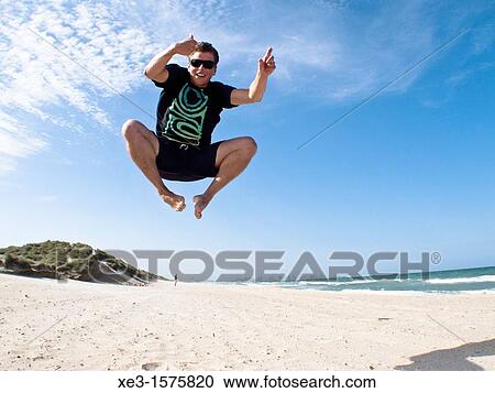 Stock Image - Boy jumping. Fotosearch
