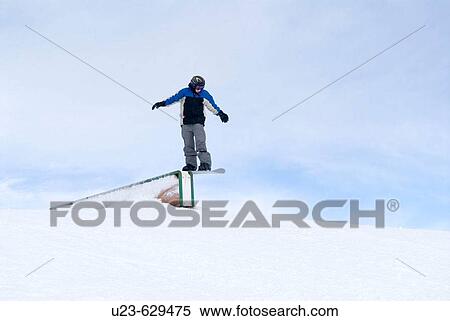 Boy jumping with snowboard. View Large Photo Image Stock Photography - Boy jumping with snowboard.. Fotosearch