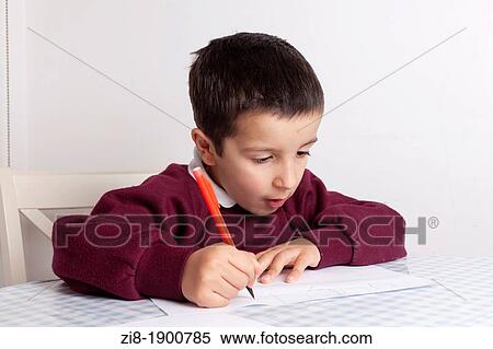 Stock Photography - Boy learning to write the alphabet. Fotosearch