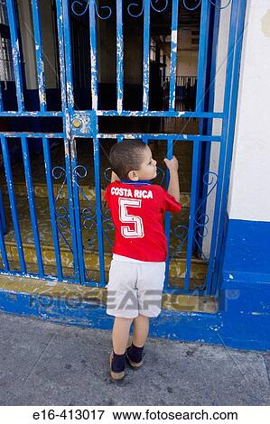 Boy looking into school, Costa Rica View Large Photo Image Stock Photo - Boy looking into school, Costa Rica. Fotosearch