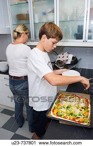 Boy making a pizza. View Large Photo Image Stock Image - Boy making a pizza.. Fotosearch