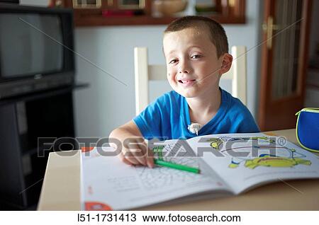 boy making fun while doing homework, Ludiente, Castell? n, Spain View Large Photo Image Stock Image - boy making fun while doing homework, Ludiente, Castell? n, Spain. Fotosearch