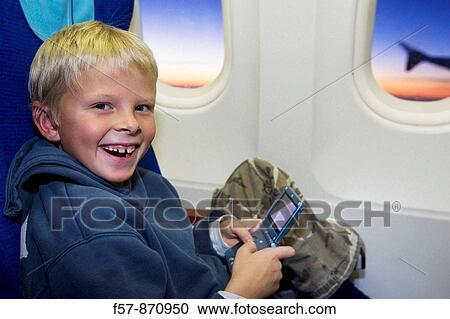 Stock Image - Boy on a 747 aircraft, Malaysia. Fotosearch