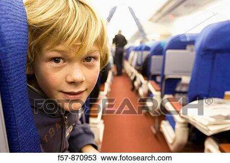 Stock Image - Boy on a 747 aircraft, Malaysia. Fotosearch