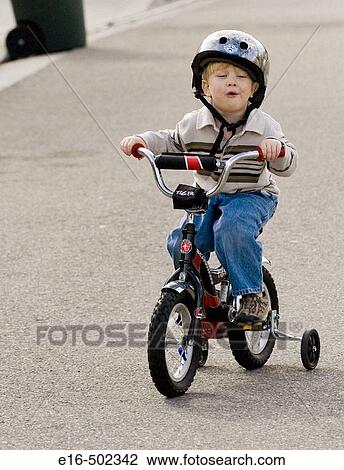 Boy on bike View Large Photo Image Stock Image - Boy on bike. Fotosearch