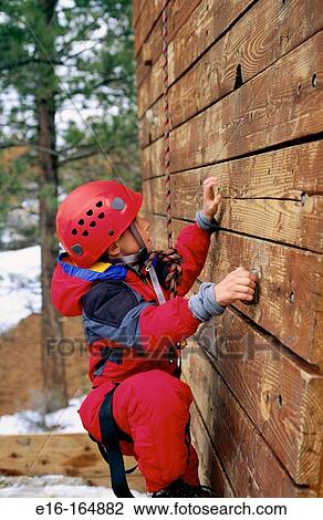 Boy on climbing wall View Large Photo Image Stock Image - Boy on climbing wall. Fotosearch