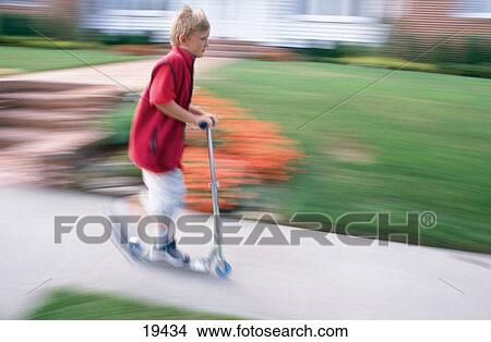 Picture - Boy on scooter. Fotosearch