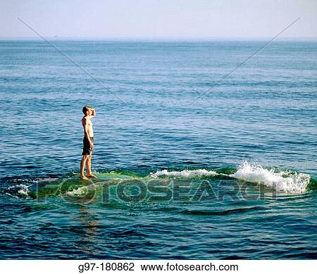 Boy on shoal. Sweden View Large Photo Image Stock Image - Boy on shoal. Sweden. Fotosearch