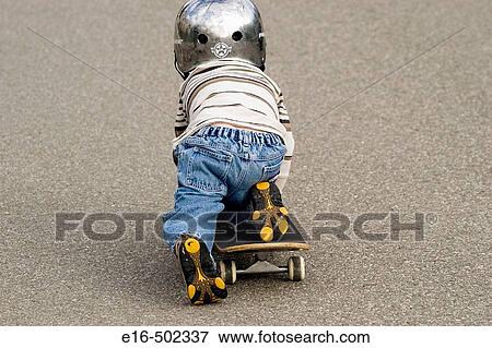 Boy on skateboard View Large Photo Image Stock Photo - Boy on skateboard. Fotosearch