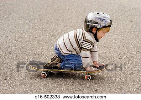 Stock Photo - Boy on skateboard. Fotosearch