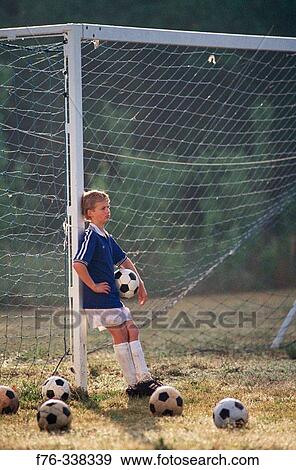Boy on soccer field View Large Photo Image Stock Photo - Boy on soccer field. Fotosearch