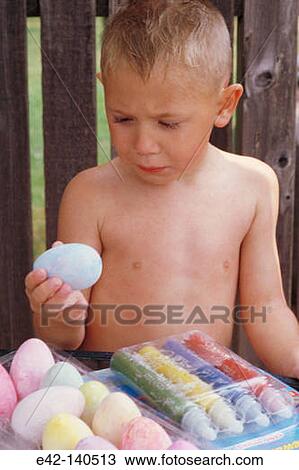 Boy painting eggs View Large Photo Image Stock Image - Boy painting eggs. Fotosearch