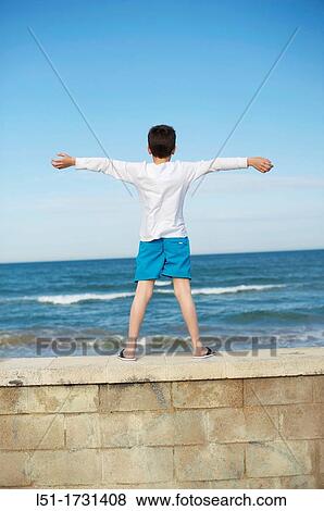 Boy playing at the beach, El Saler beach, Albufera de Valencia Nature Reserve, Spain, Valencia View Large Photo Image Stock Photo - Boy playing at the beach, El Saler beach, Albufera de Valencia Nature Reserve, Spain, Valencia. Fotosearch