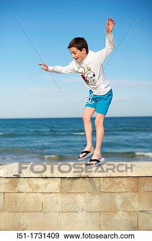 Boy playing at the beach, El Saler beach, Albufera de Valencia Nature Reserve, Spain, Valencia View Large Photo Image Stock Photo - Boy playing at the beach, El Saler beach, Albufera de Valencia Nature Reserve, Spain, Valencia. Fotosearch