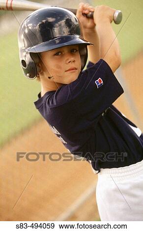 Stock Photo - Boy playing baseball. Fotosearch